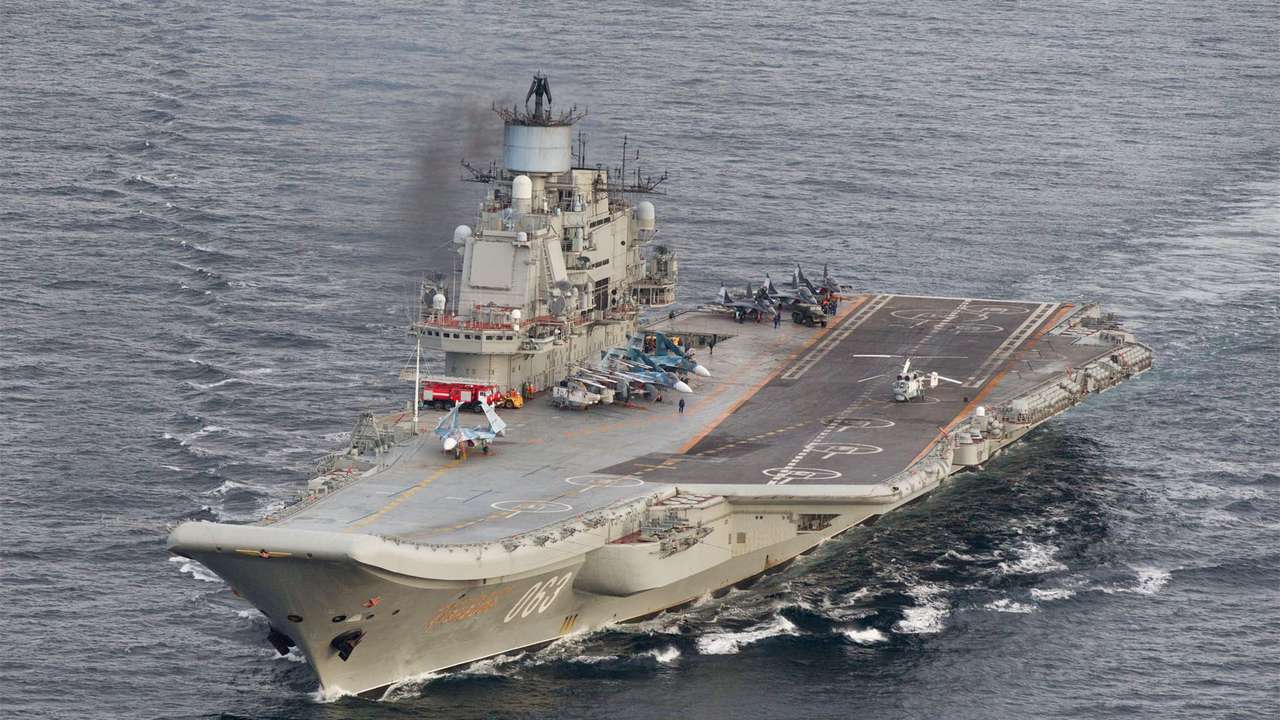 FILE PHOTO: A photo taken from a Norwegian surveillance aircraft shows Russian aircraft carrier Admiral Kuznetsov in international waters off the coast of Northern Norway