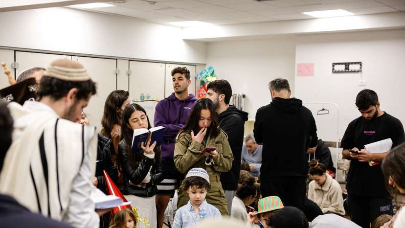 Israelis gather in a bomb shelter after missiles were launched towards Israel from Iran, in Tel Aviv