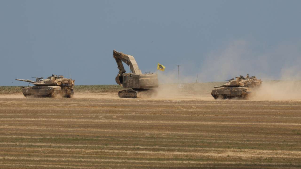 Israeli tanks manoeuvre near the Israel-Gaza Border