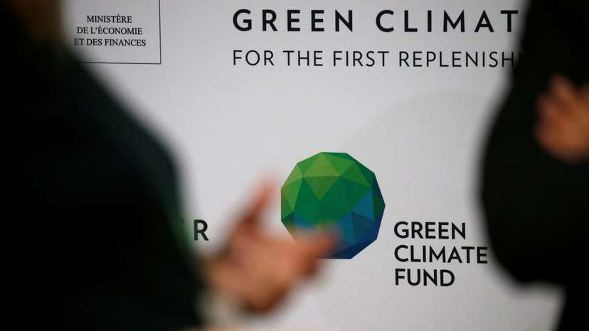 People arrive to attend the Pledging Conference of the Green Climate Fund (GCF) for the First Replenishment in Paris
