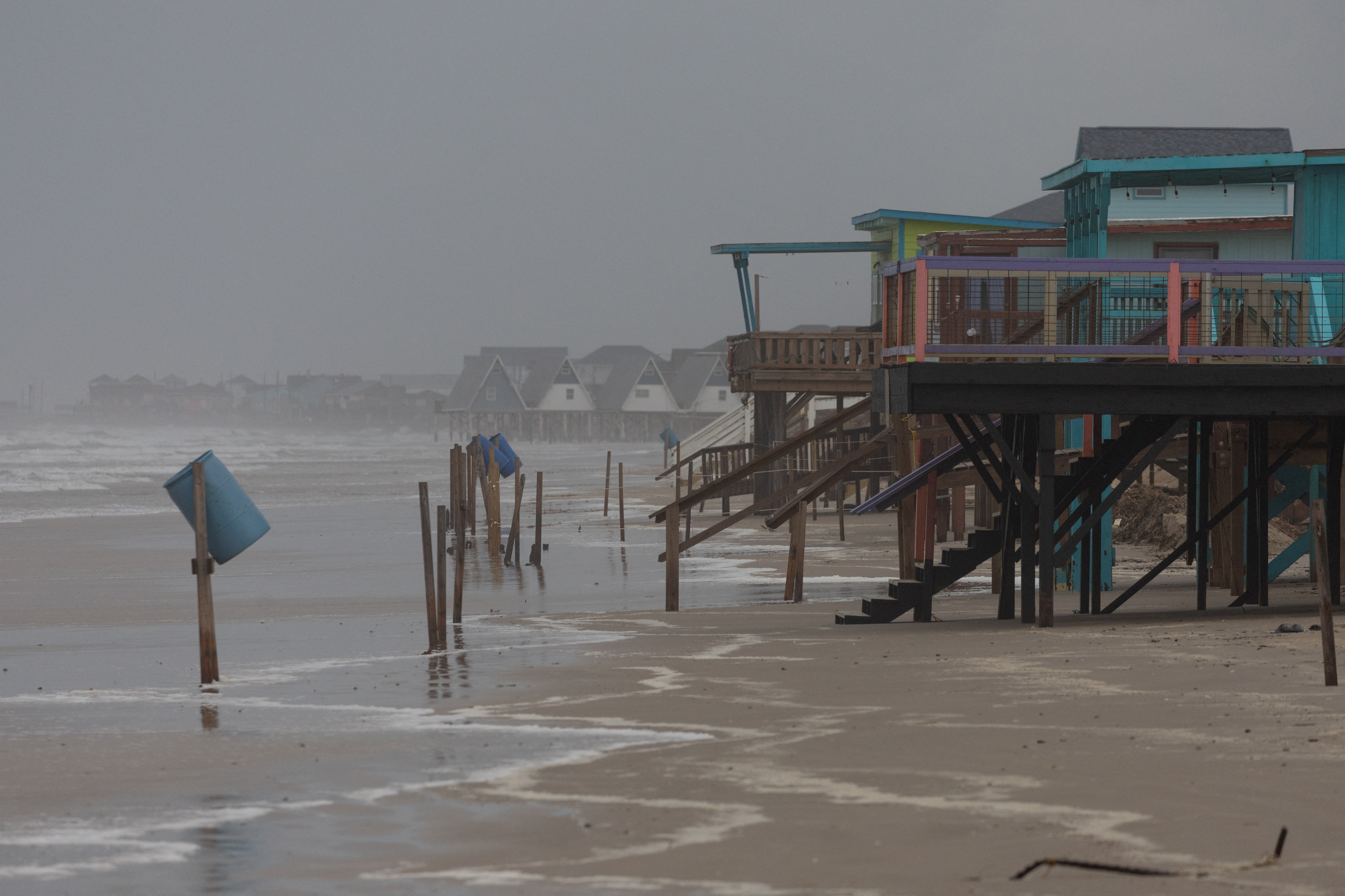 Rain and swells from Hurricane Beryl approach homes along Surfside Beach, Texas