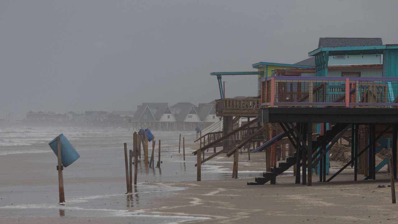 Rain and swells from Hurricane Beryl approach homes along Surfside Beach, Texas