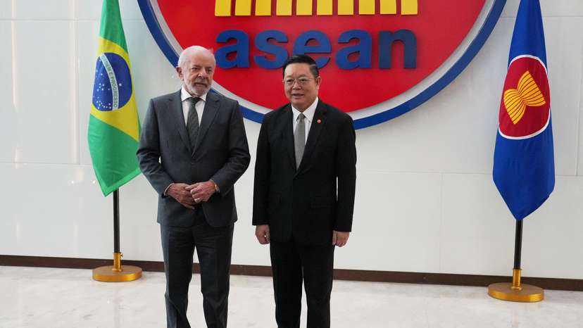 Brazil's President Luiz Inacio Lula da Silva stands for a photograph with ASEAN Secretary-General Kao Kim Hourn during their meeting in Jakarta