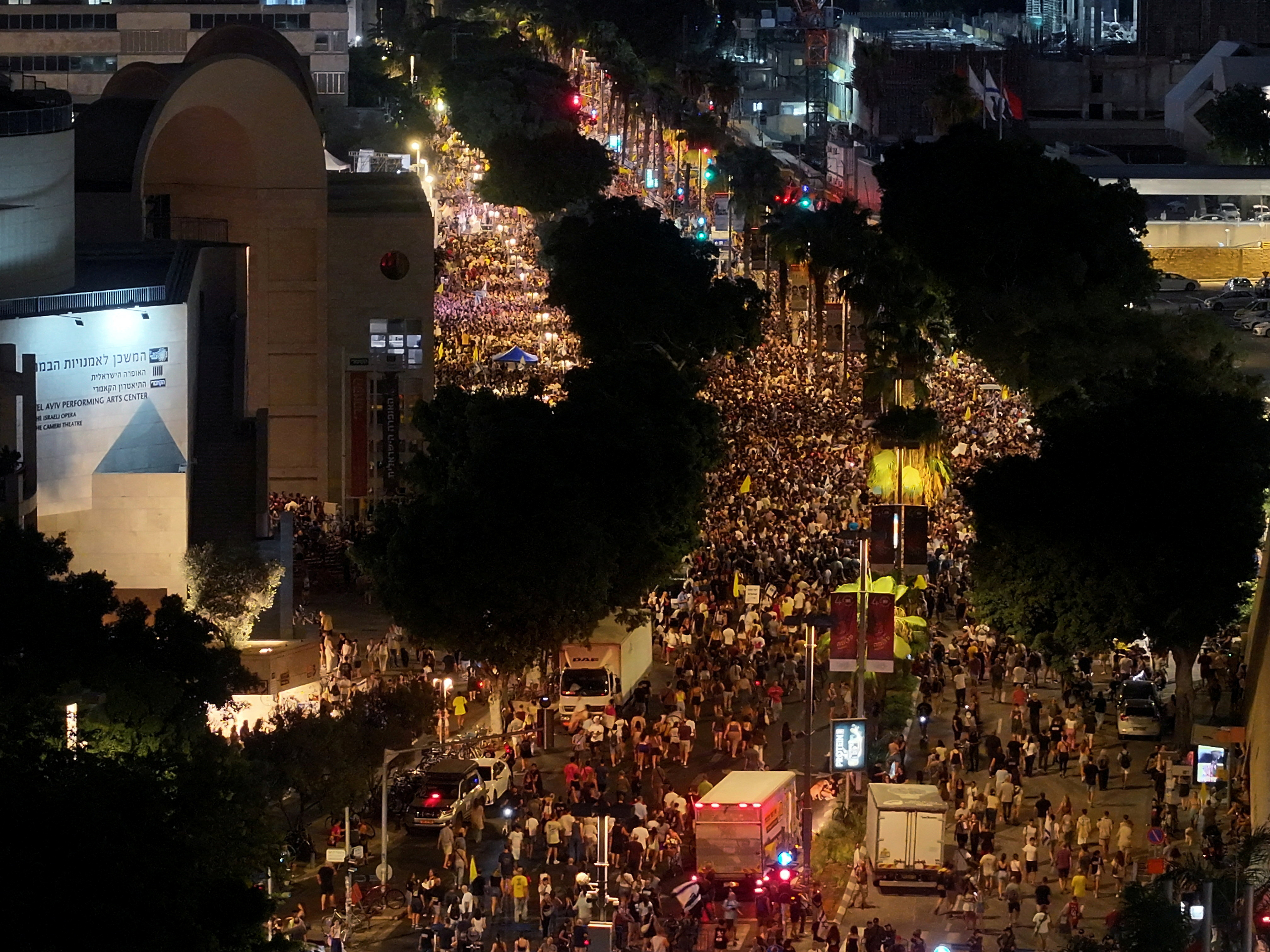 FILE PHOTO: People protest as they demand the release of all Israeli hostages and ending the war in Gaza, in Tel Aviv