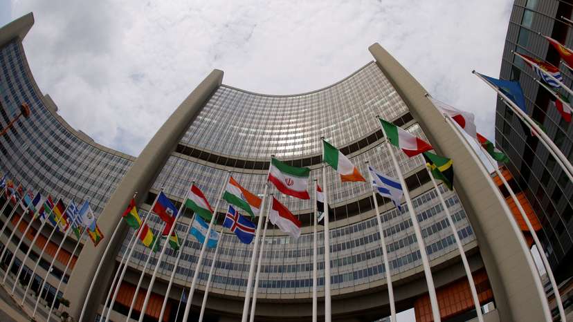 The Iranian and other flags flutter in front of the International Atomic Energy Agency (IAEA) organisation's headquarters in Vienna