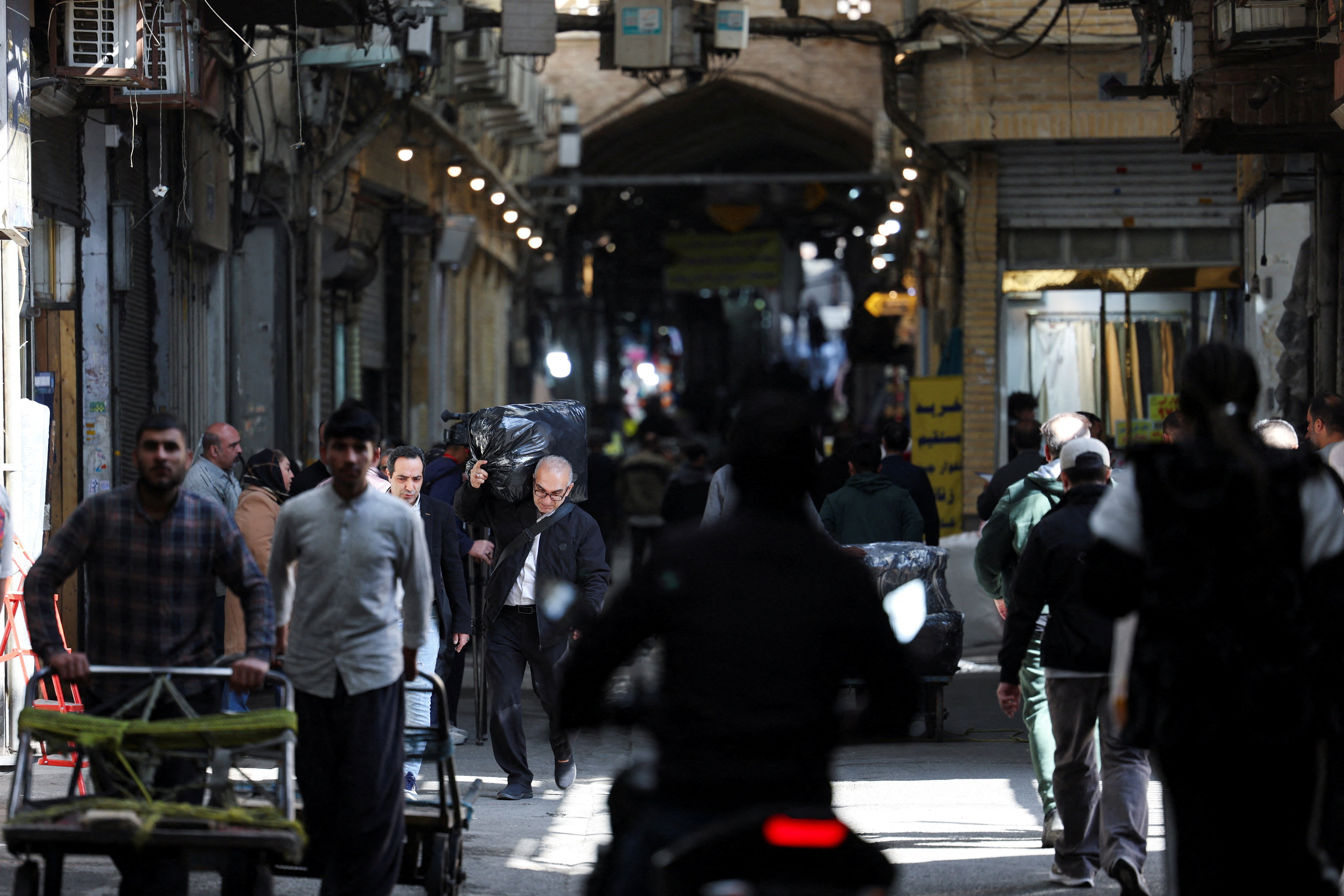 People visit the Grand Bazaar, in Tehran