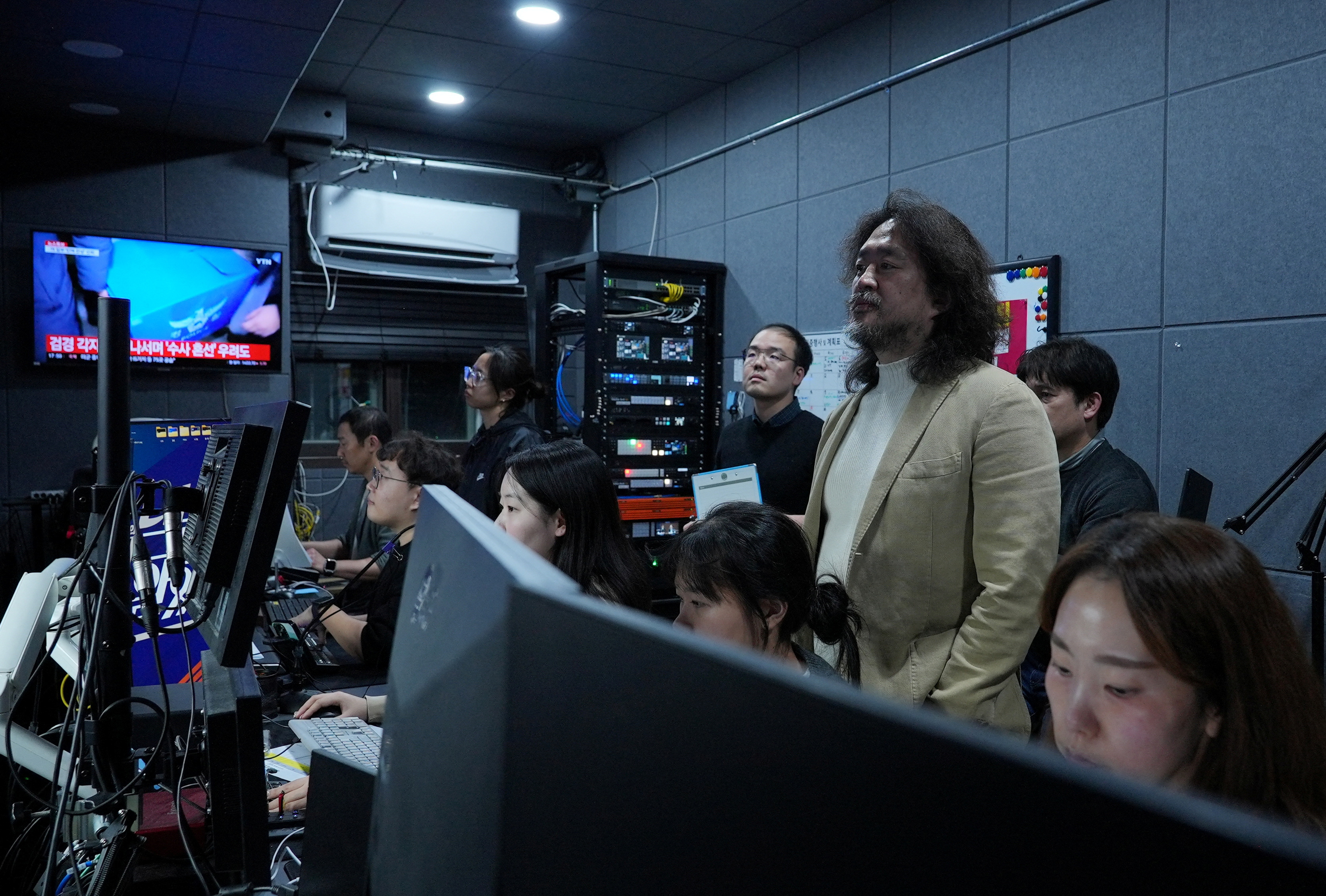 South Korean journalist Kim Ou-joon checks a live broadcast after an interview with Reuters at his recording studio in Seoul