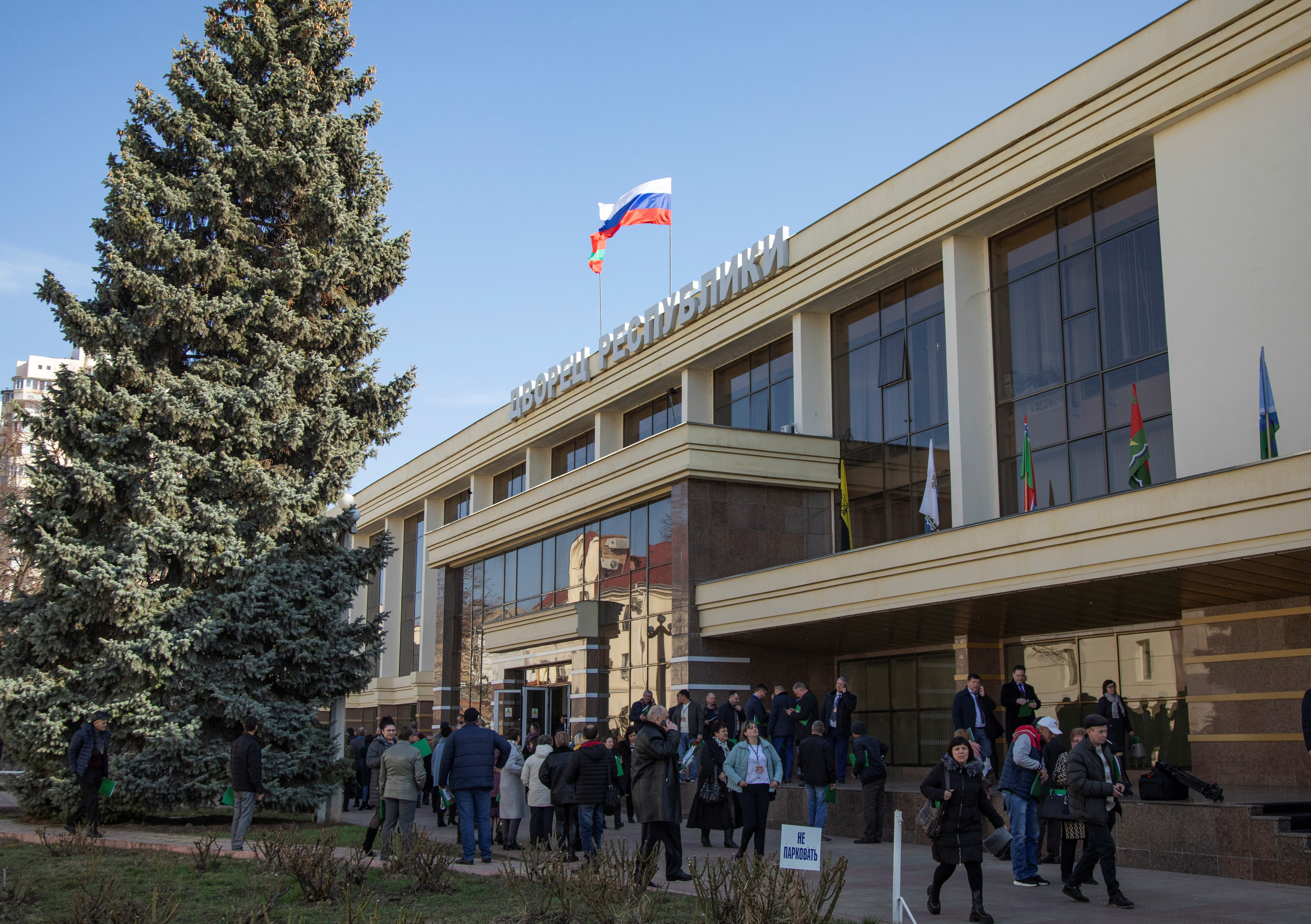 Delegates gather to take part in the congress of deputies, in front of the Palace of the Republic in Tiraspol