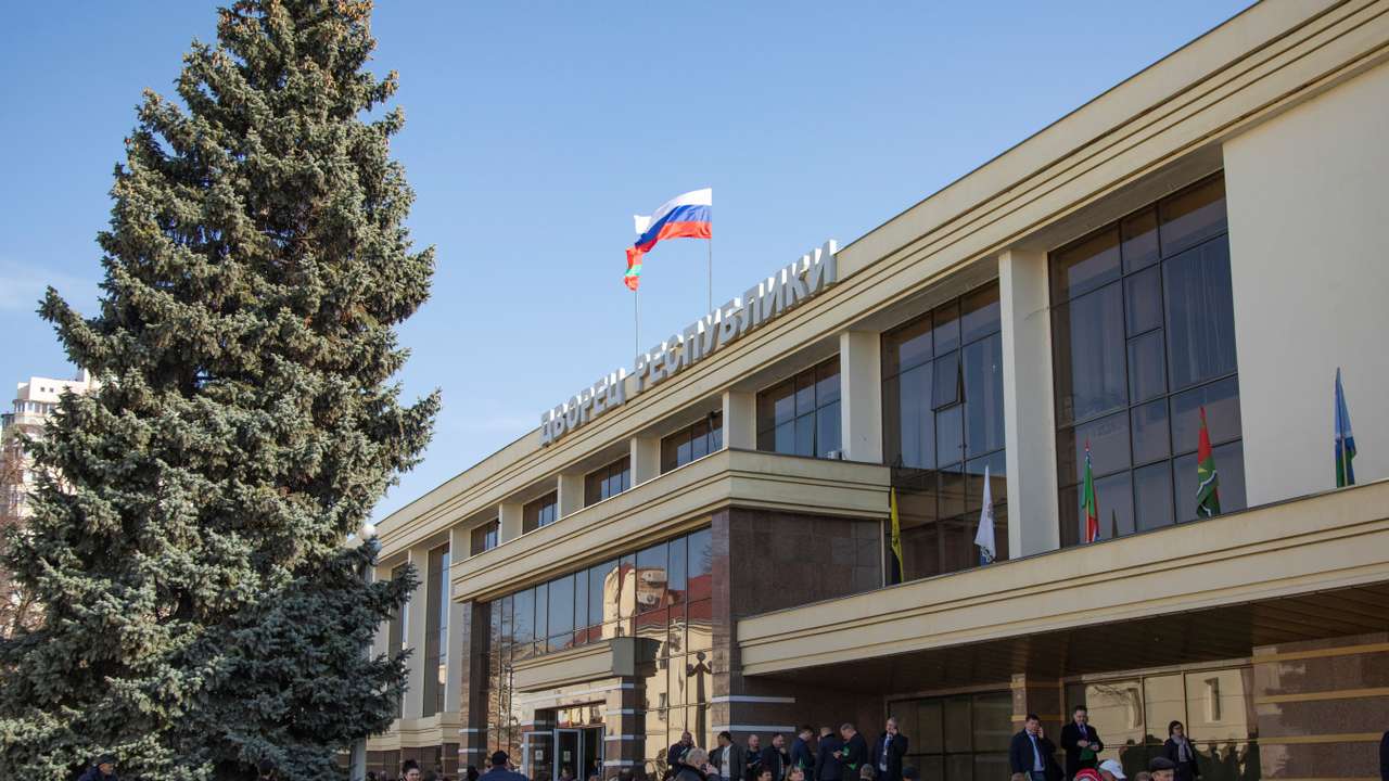 Delegates gather to take part in the congress of deputies, in front of the Palace of the Republic in Tiraspol