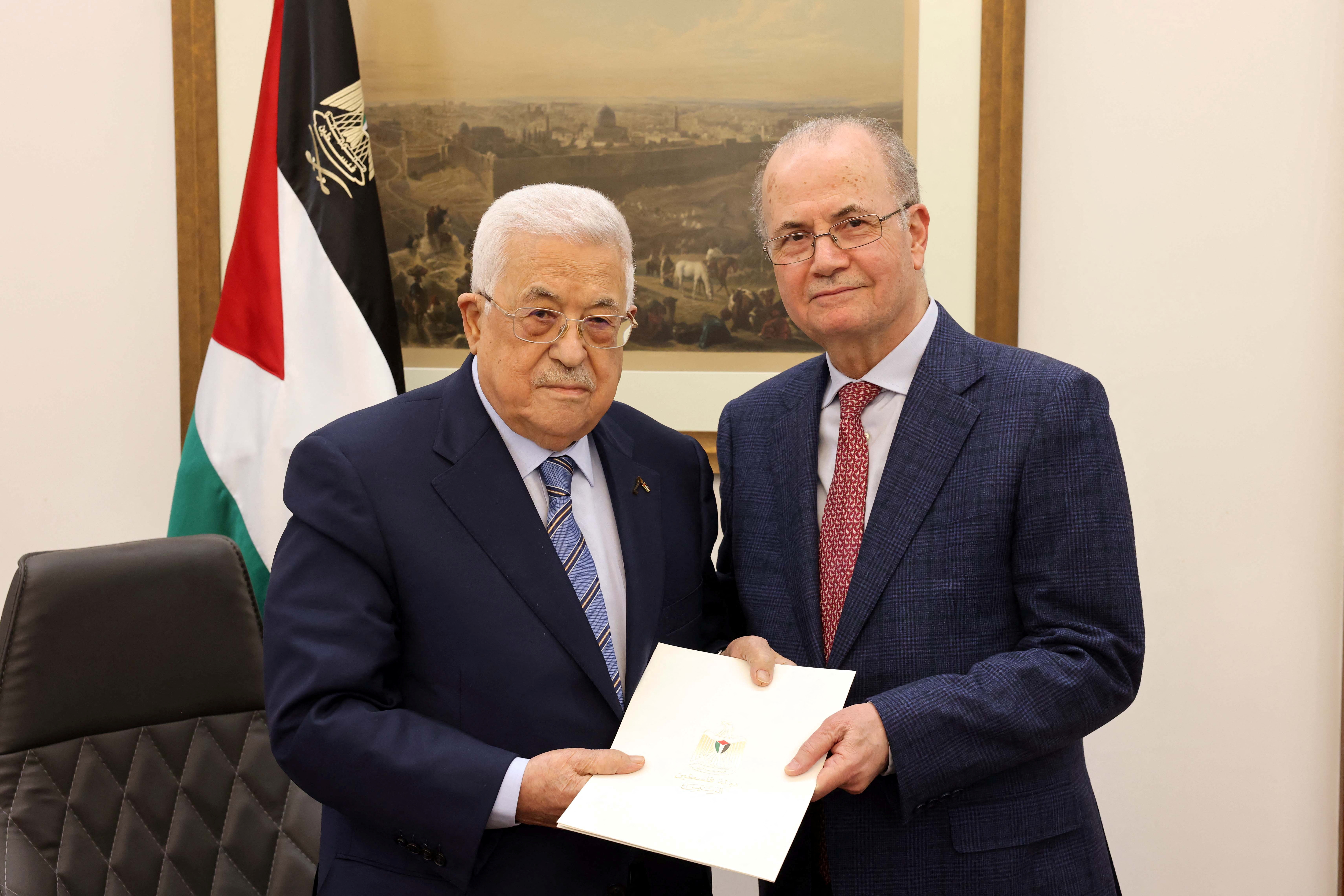 FILE PHOTO: Palestinian President Mahmoud Abbas points Mohammad Mustafa as prime minister of the Palestinian Authority