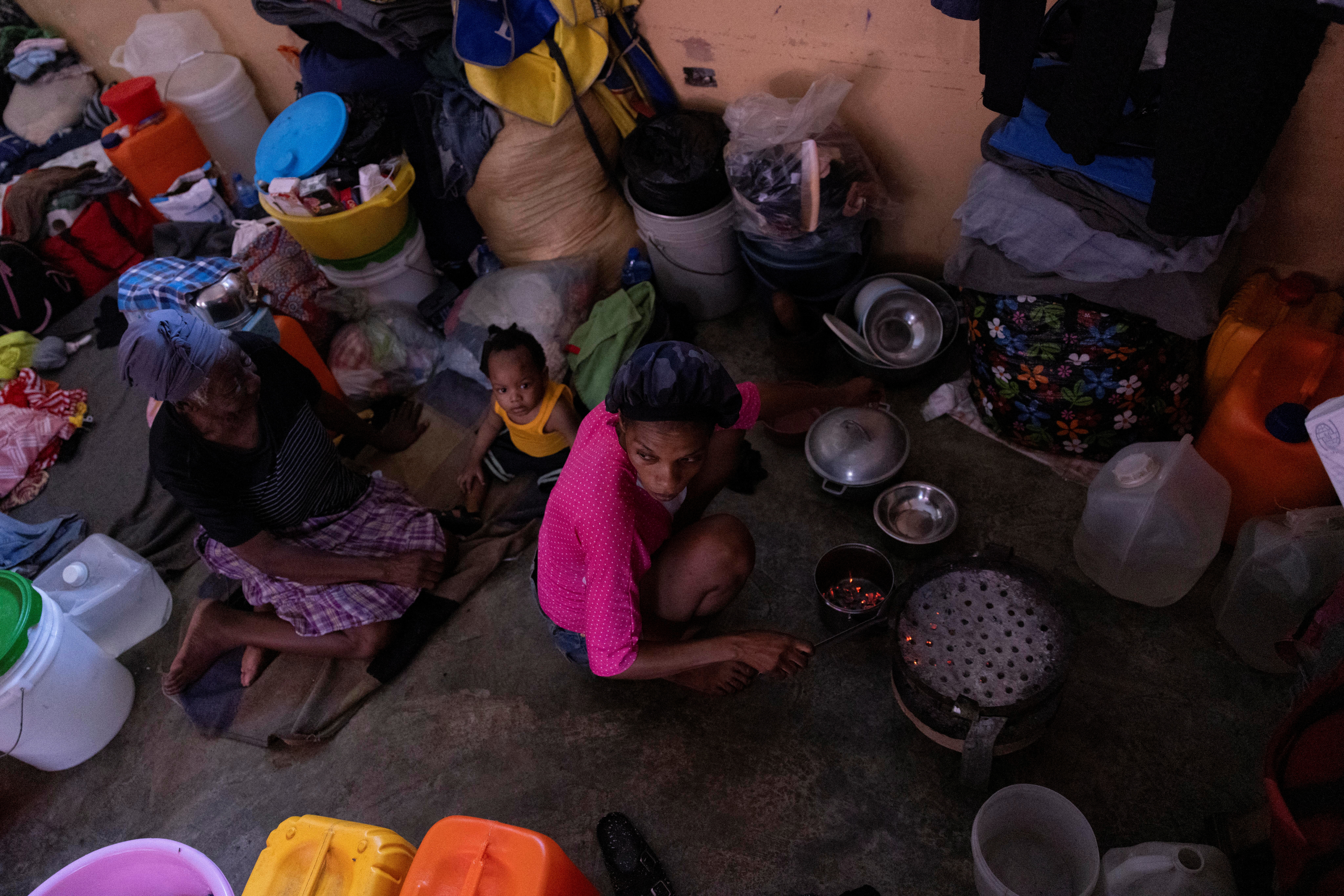 People displaced by gang war violence shelter at the Darius Denis school in Port-au-Prince