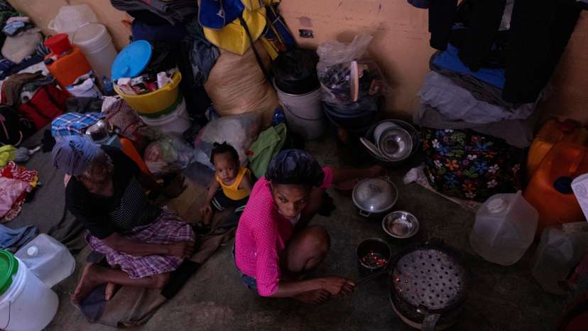 People displaced by gang war violence shelter at the Darius Denis school in Port-au-Prince