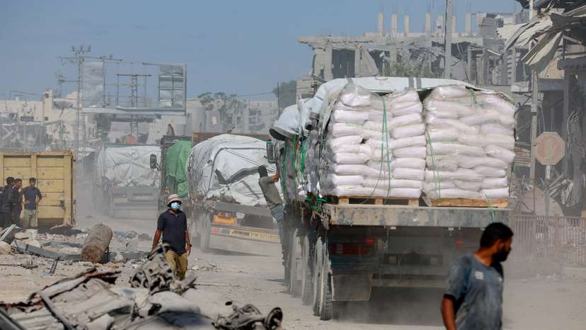 Trucks carry aid for Palestinians in Khan Younis
