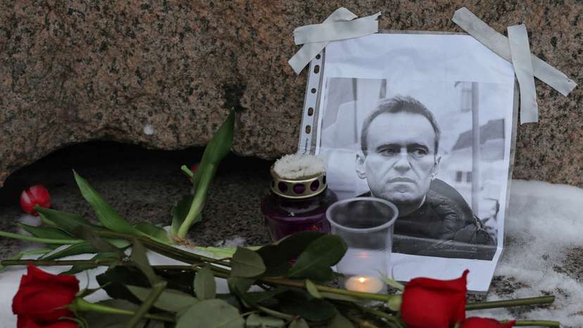 People gather at the monument to the victims of political repressions following the death of Alexei Navalny in Saint Petersburg
