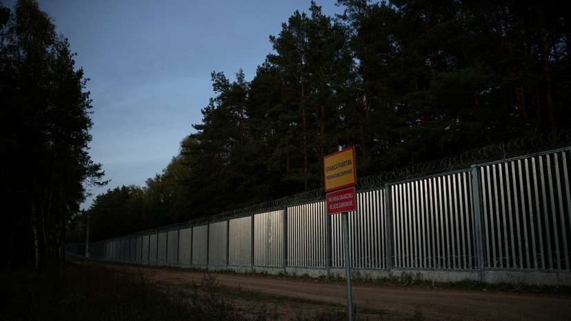 FILE PHOTO: General view of the fence on the Polish-Belarusian border at sunset, during the migrant crisis, in Opaka Duza