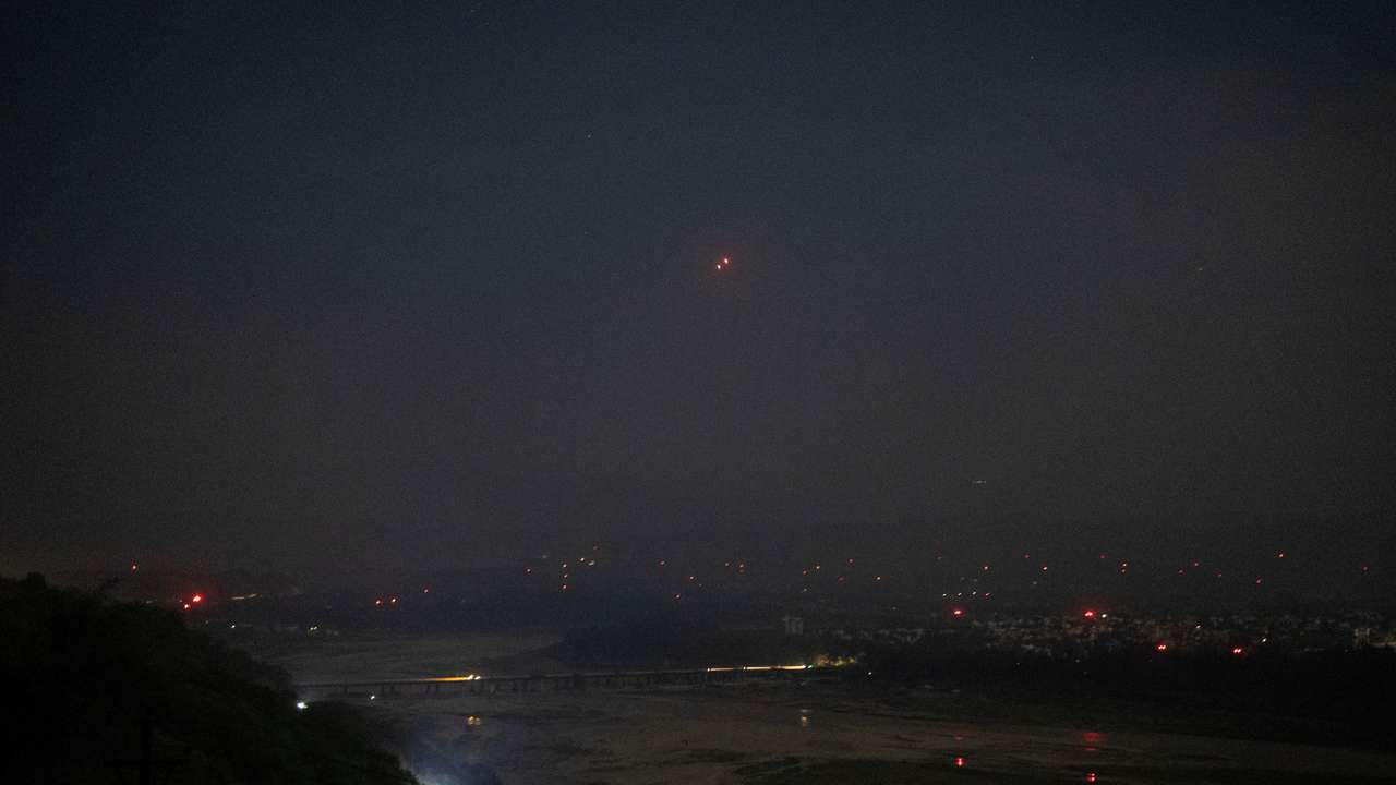 India's air defence system intercepts objects in the sky during a blackout following multiple blasts in the city of Jammu