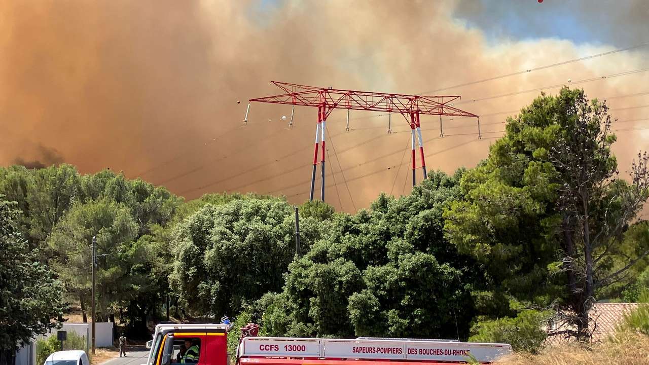 FILE PHOTO: High winds fan wildfire in southern France near Marseille