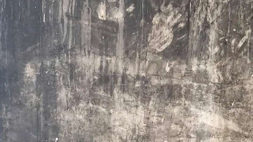 FILE PHOTO: Handprints on a blackened wall at Grenfell Tower, in London