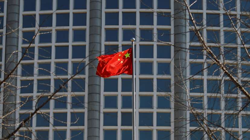 Chinese flag flutters outside the foreign ministry in Beijing