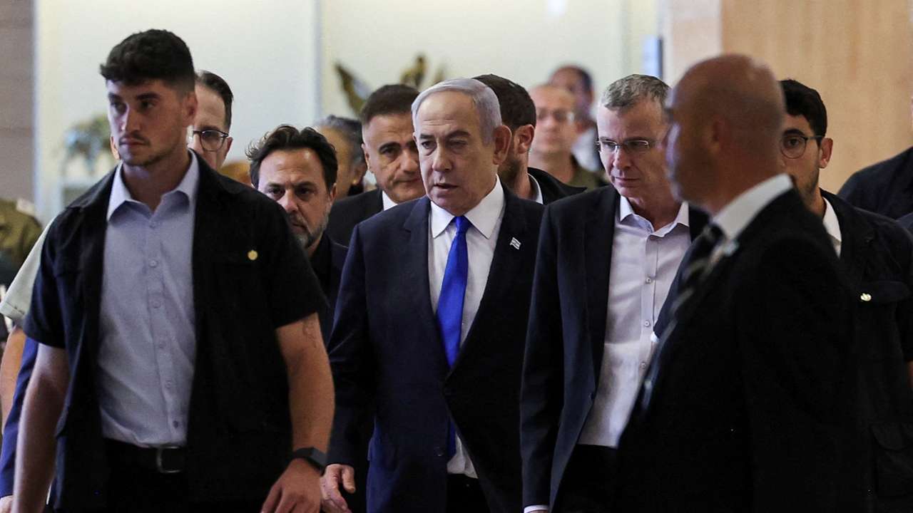 Israeli Prime Minister Netanyahu arrives to his Likud party faction meeting at the Knesset,in Jerusalem