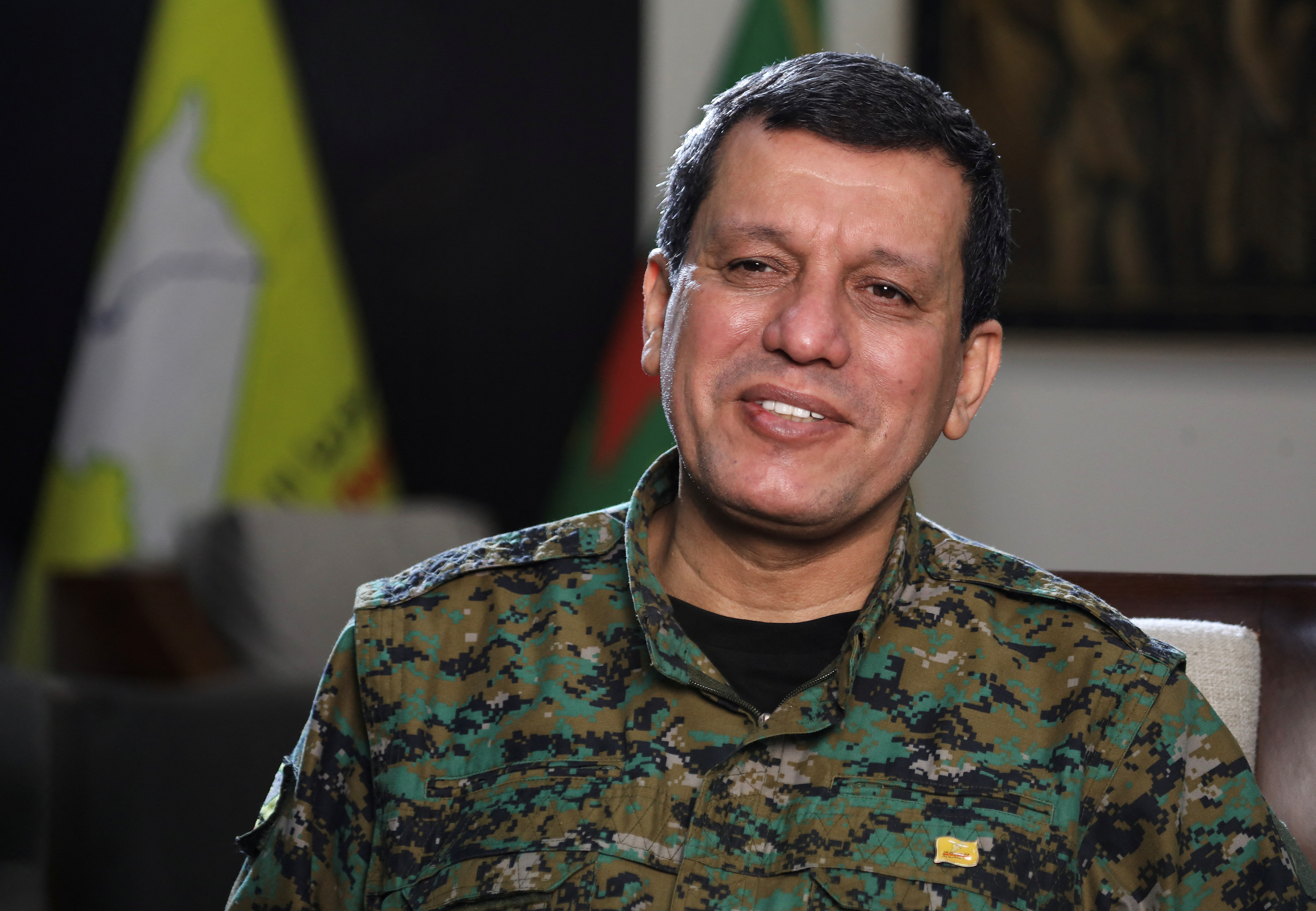 FILE PHOTO: Commander of Syrian Kurdish-led forces Mazloum Abdi, attends an interview with Reuters in Hasakah