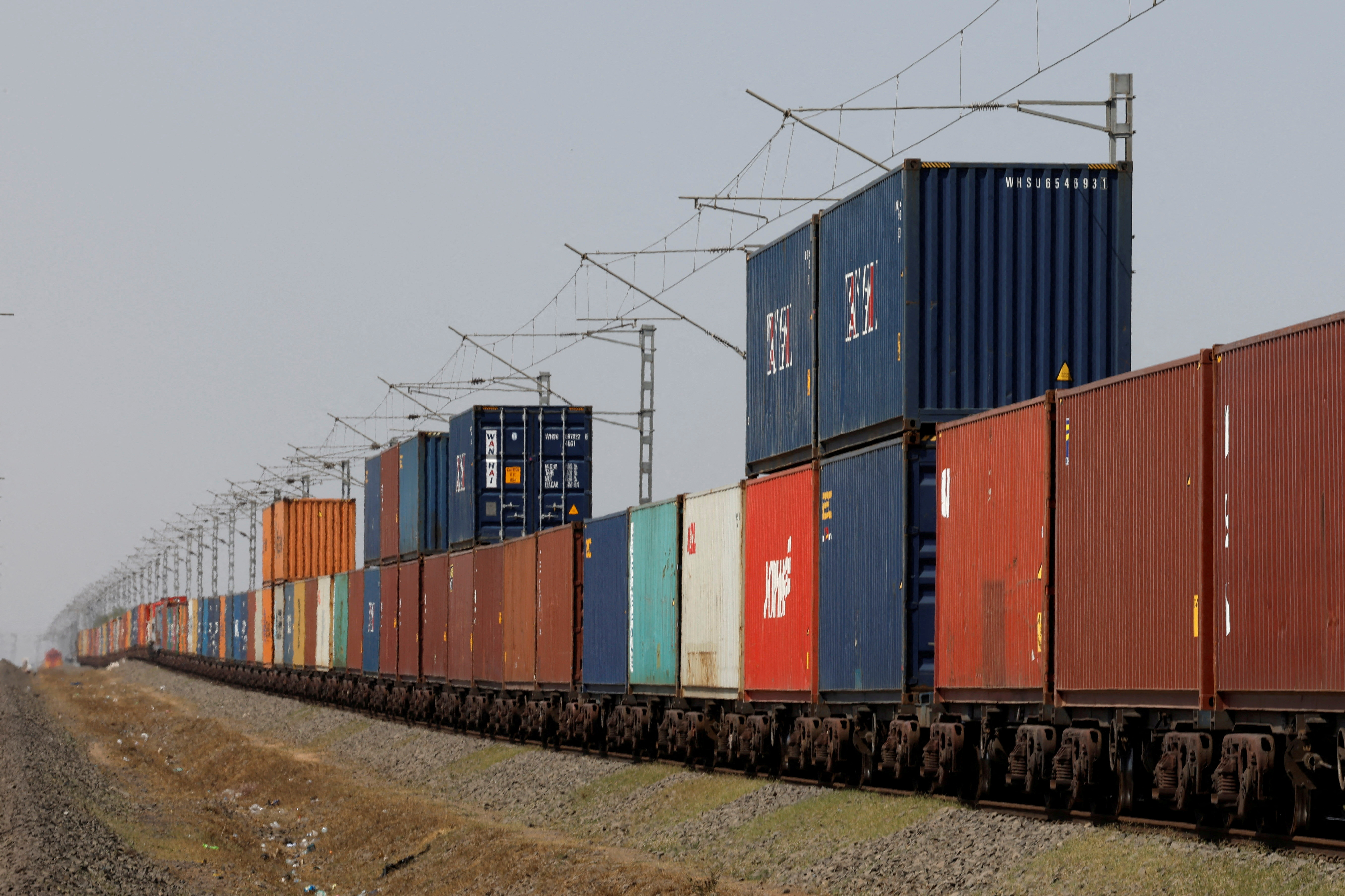 FILE PHOTO: Containers are transported by train near the Deendayal Port in Kandla