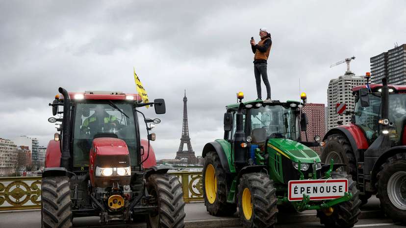 Farmers protest ahead of the opening of the Paris farm show, in Paris