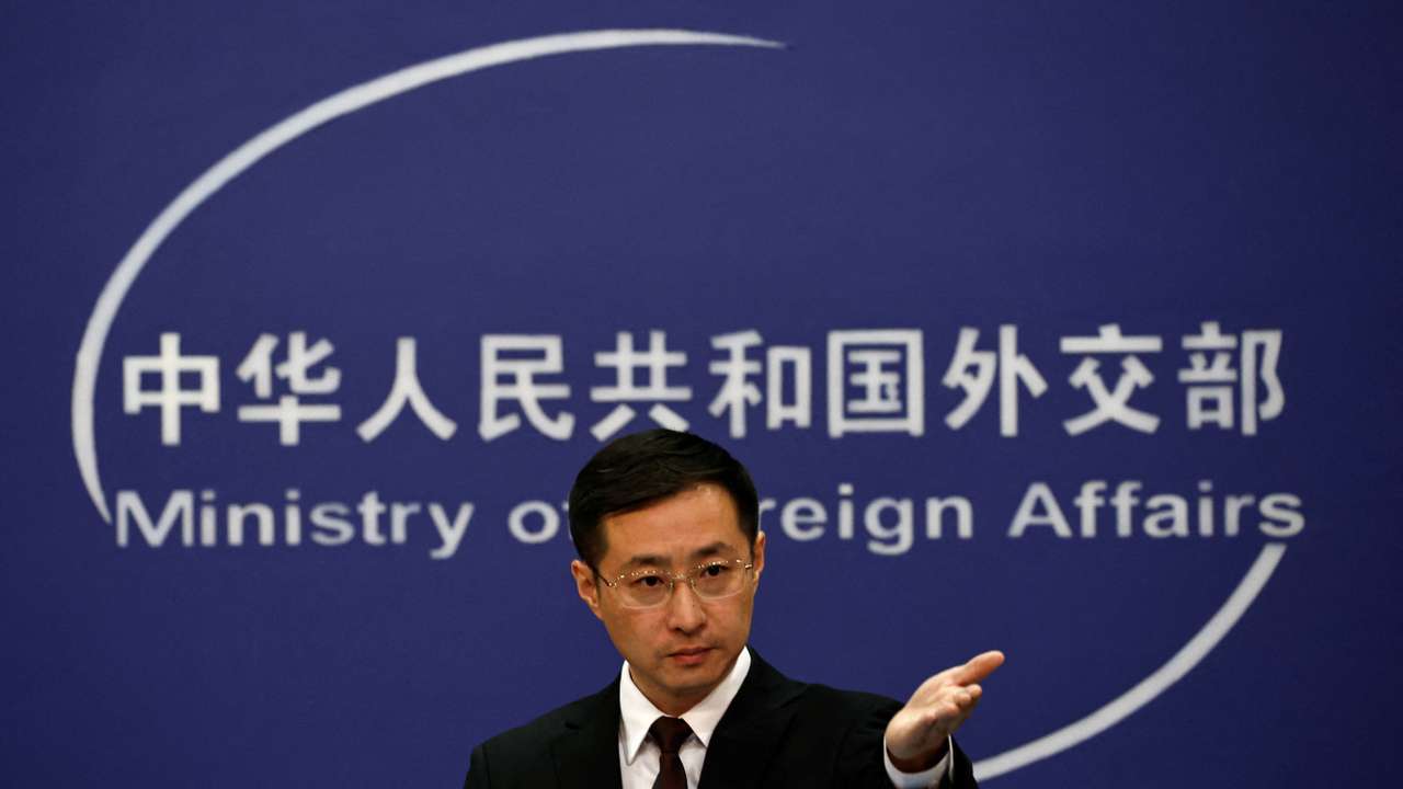 Chinese Foreign Ministry spokesperson Lin Jian gestures during a press conference in Beijing
