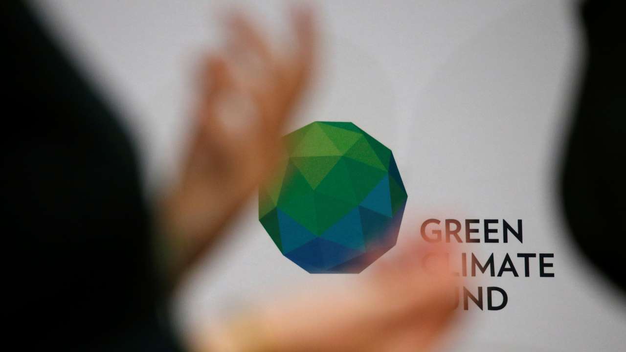 People arrive to attend the Pledging Conference of the Green Climate Fund (GCF) for the First Replenishment in Paris