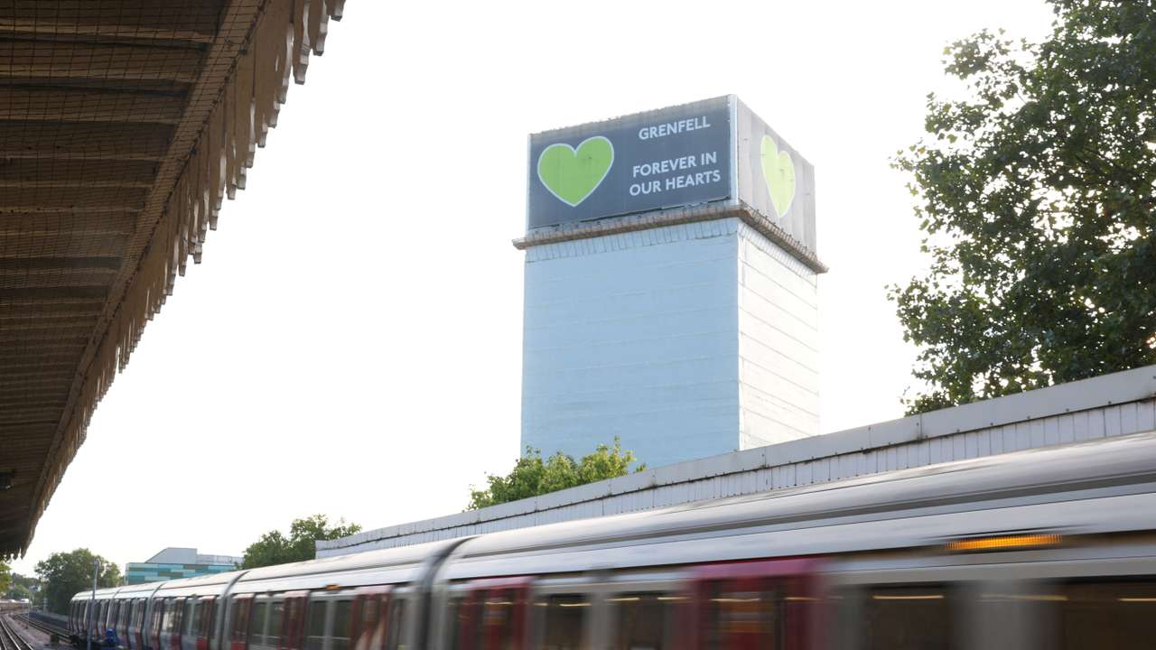 Covered remains of Grenfell Tower seen, as report from UK public inquiry into the deadly 2017 Grenfell fire published, in London
