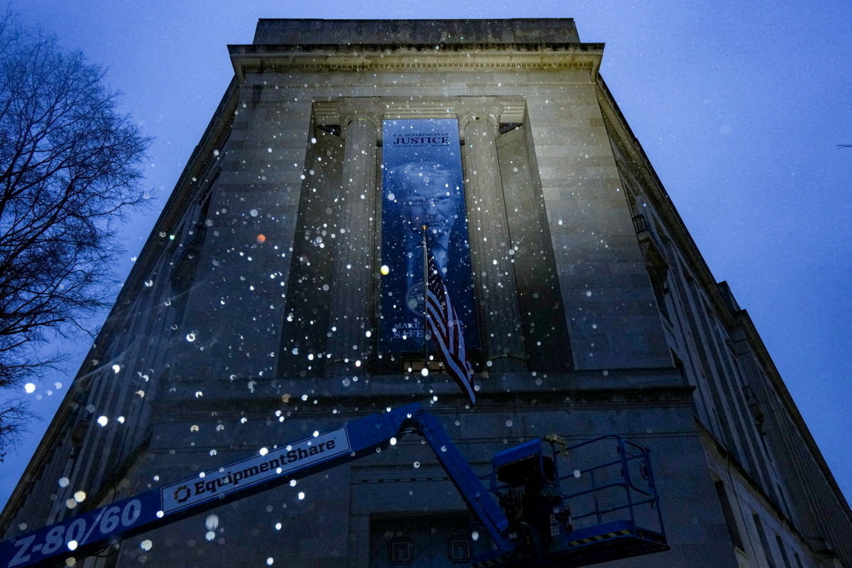 New banner depicting U.S. President Donald Trump is put up on the Department of Justice building in Washington, D.C.