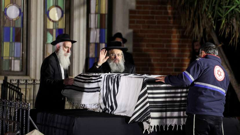 FILE PHOTO: Mourners attend the funeral of Israeli rabbi, Zvi Kogan, in Kfar Habad