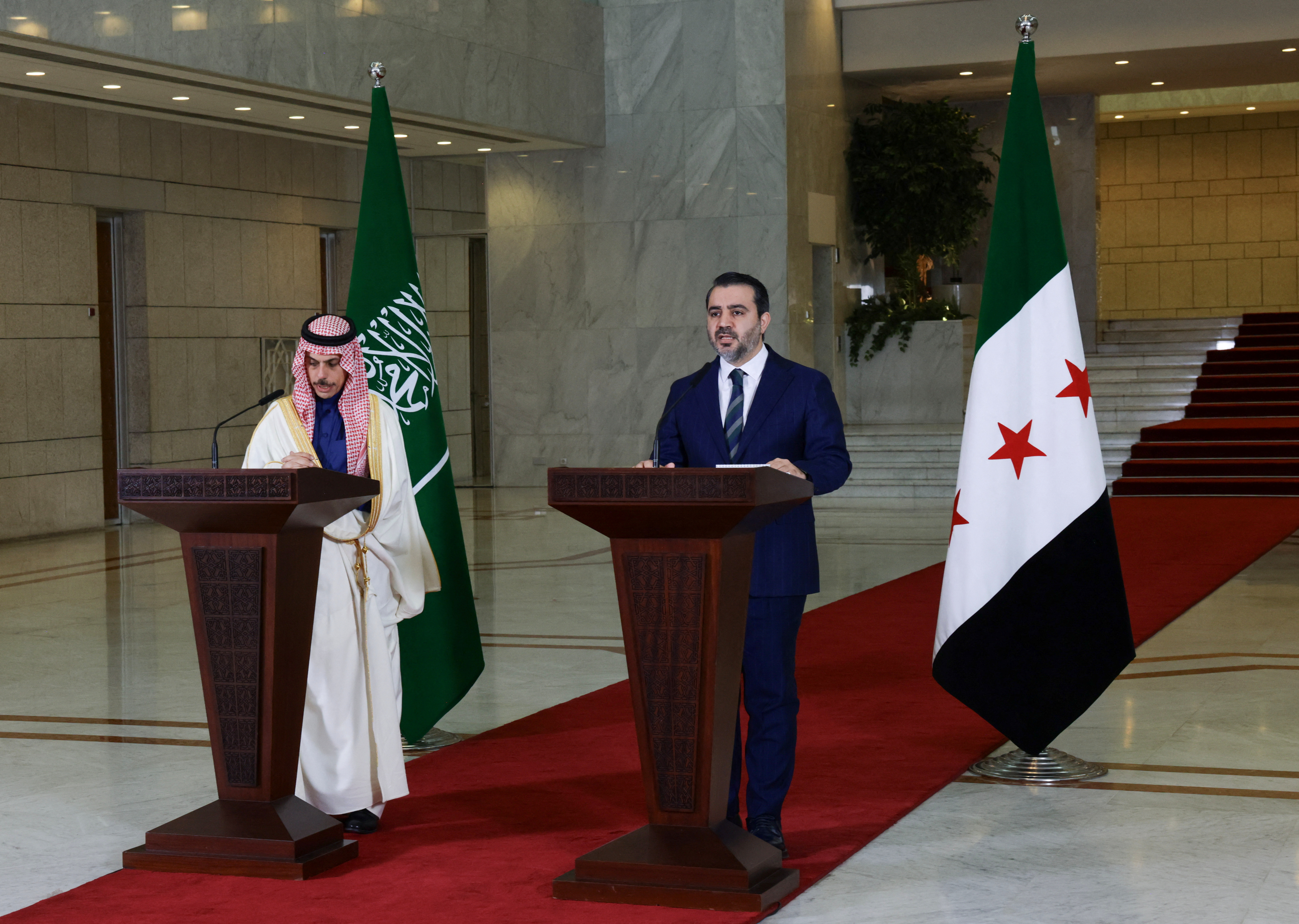 Saudi Arabia's Foreign Minister Prince Faisal bin Farhan Al-Saud attends a press conference with Syrian Foreign Minister Asaad Hassan al-Shibani in Damascus