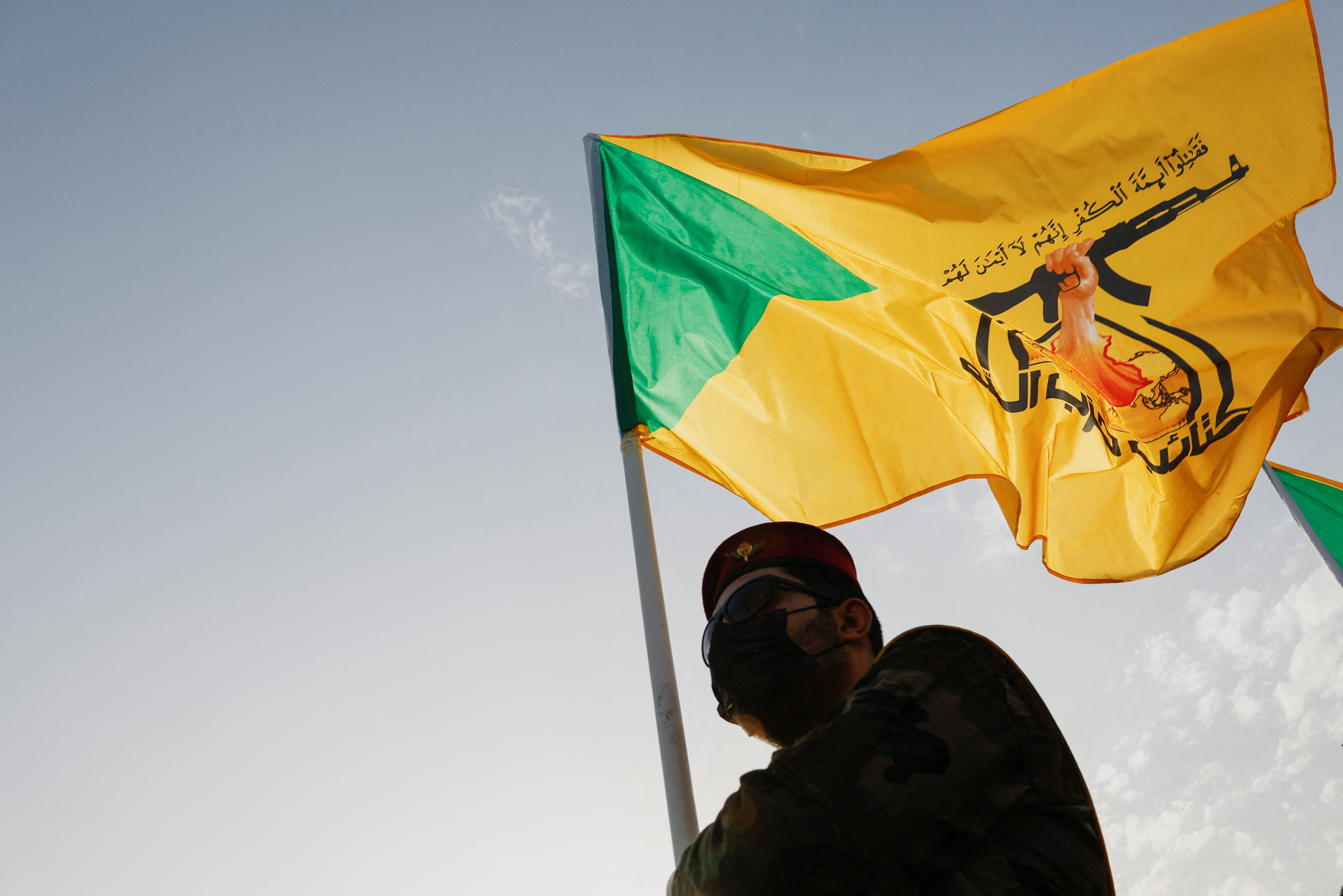 A mourner attends the funeral of a commander from Iraq's Kataib Hezbollah armed group, in Baghdad