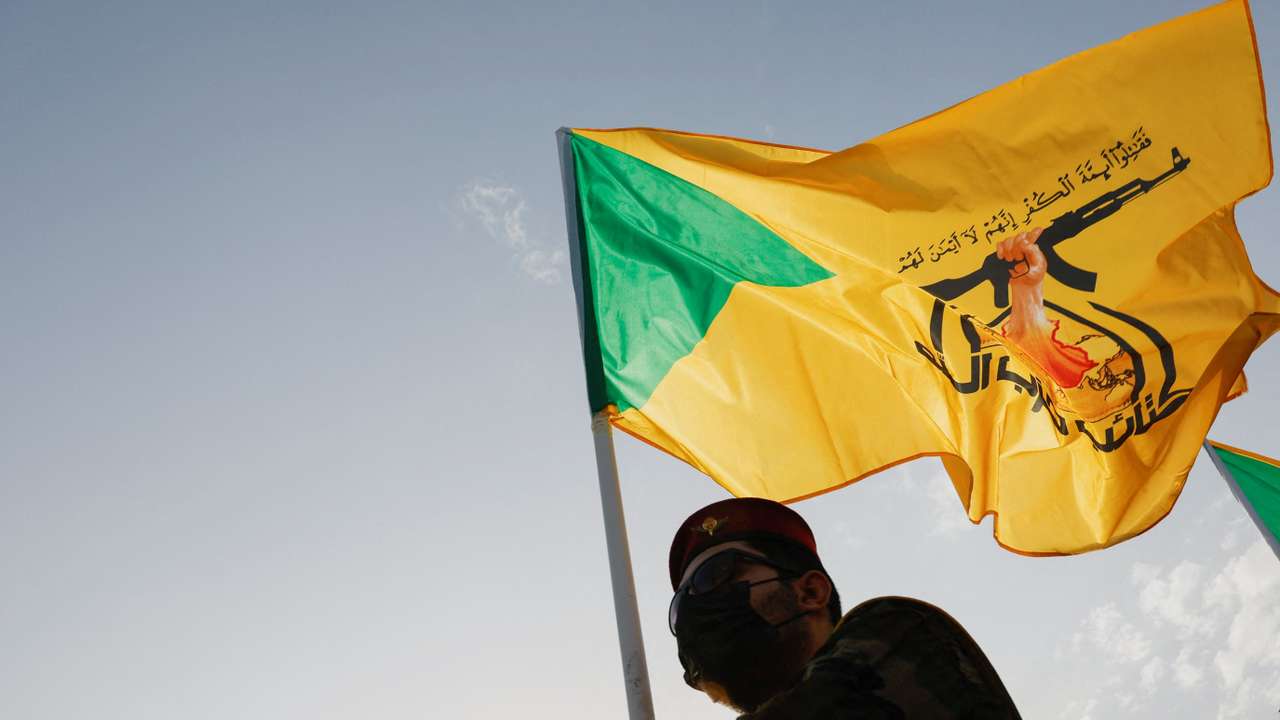 A mourner attends the funeral of a commander from Iraq's Kataib Hezbollah armed group, in Baghdad