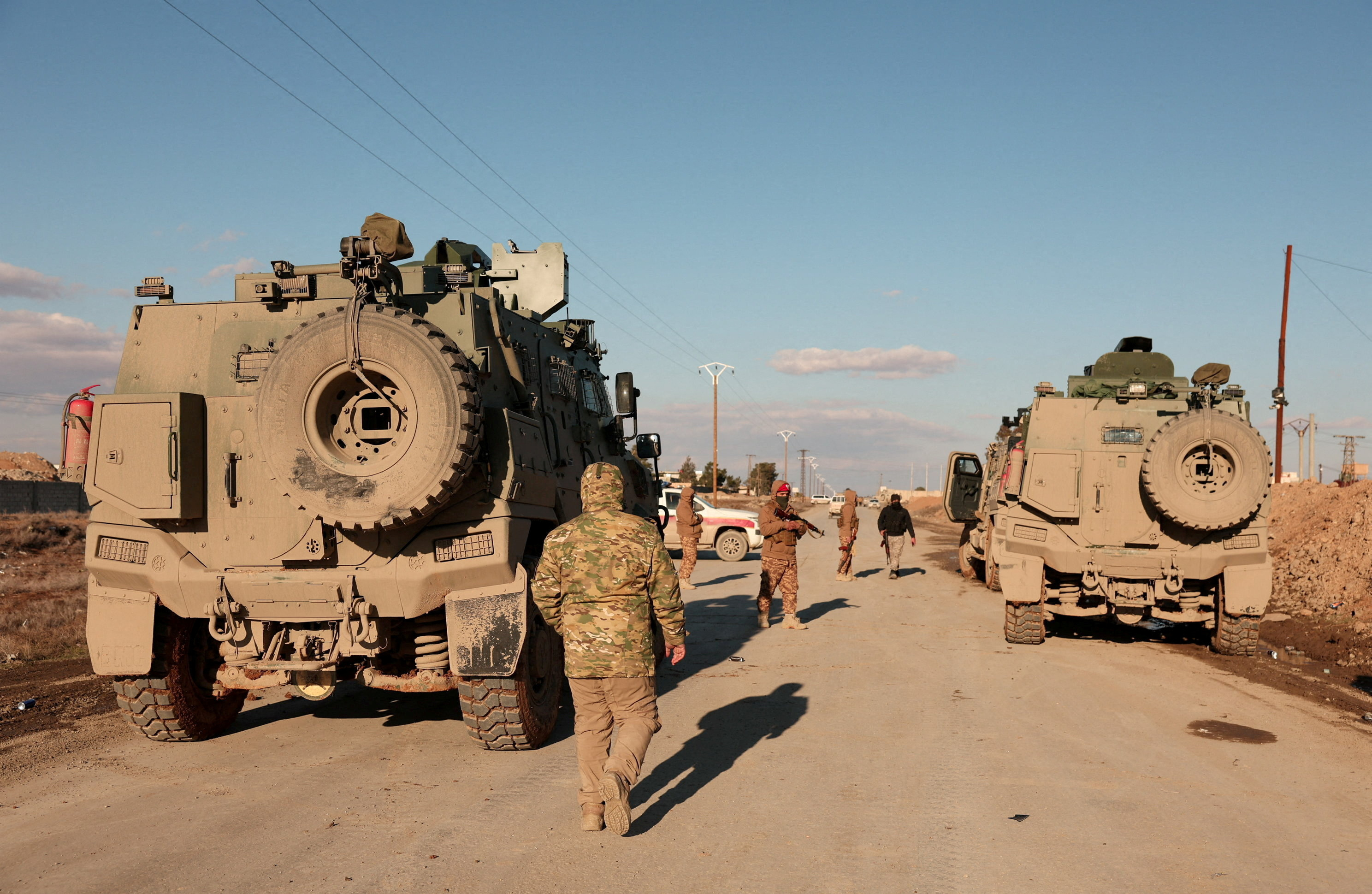 FILE PHOTO: Military members gather near Raqqa prison