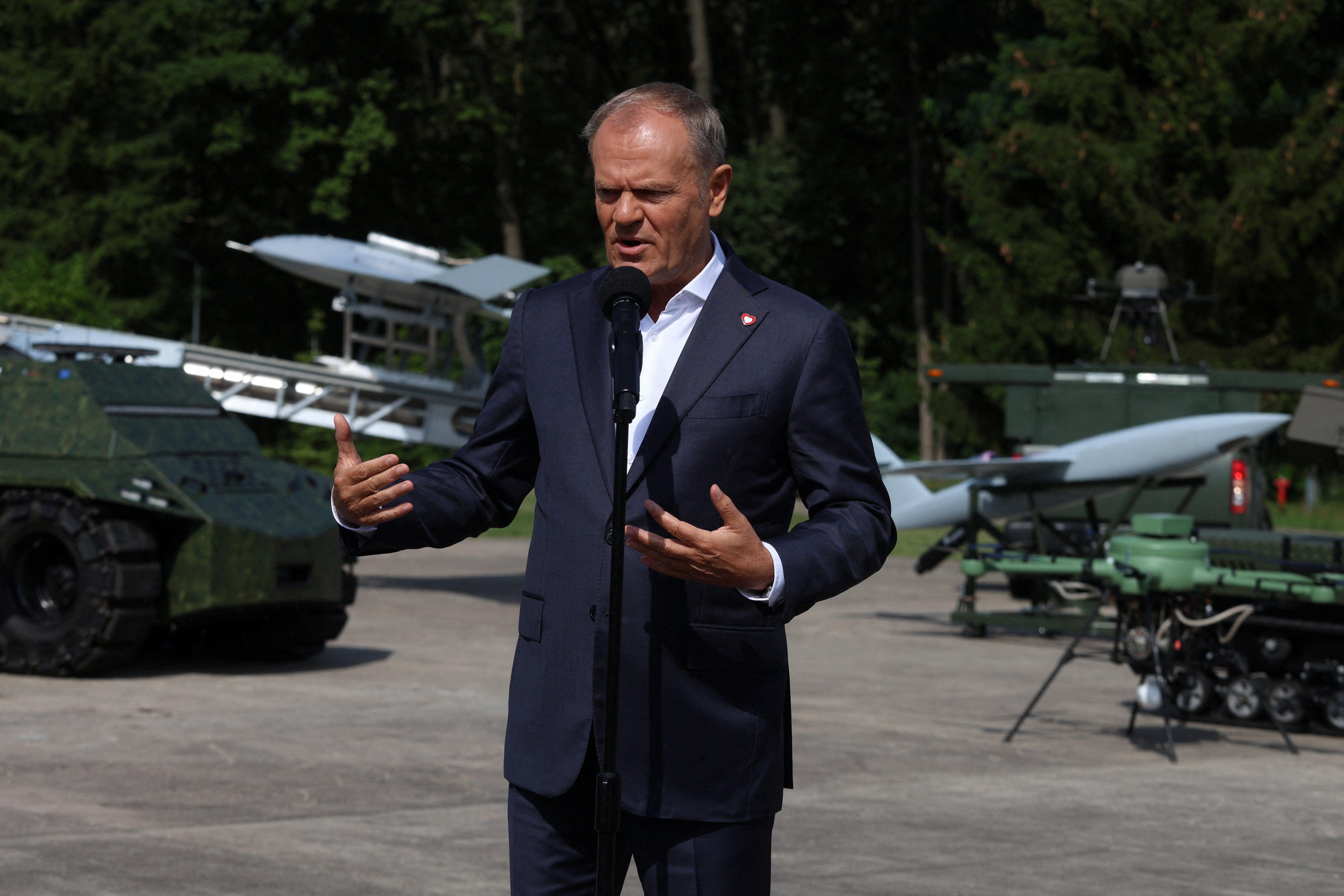 Poland's PM Tusk attends a press conference after a briefing with the management of military institutes at the Air Force Institute of Technology in Warsaw