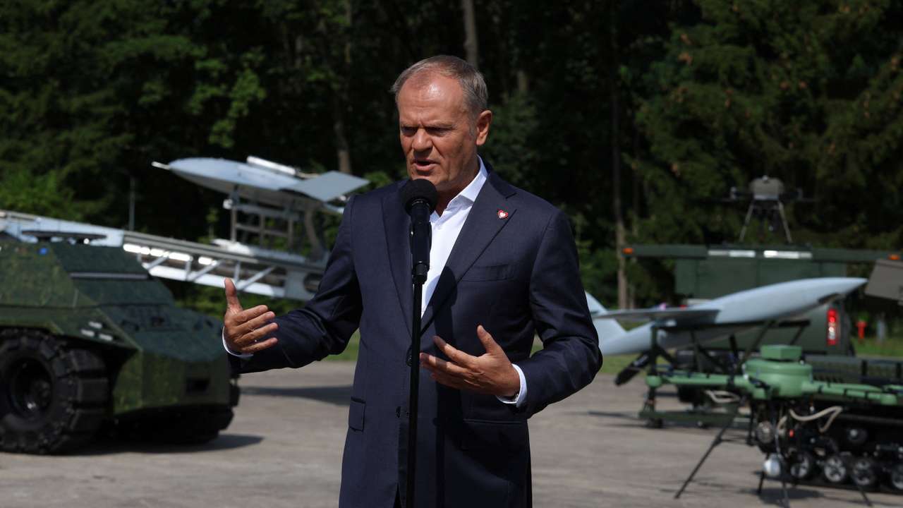 Poland's PM Tusk attends a press conference after a briefing with the management of military institutes at the Air Force Institute of Technology in Warsaw