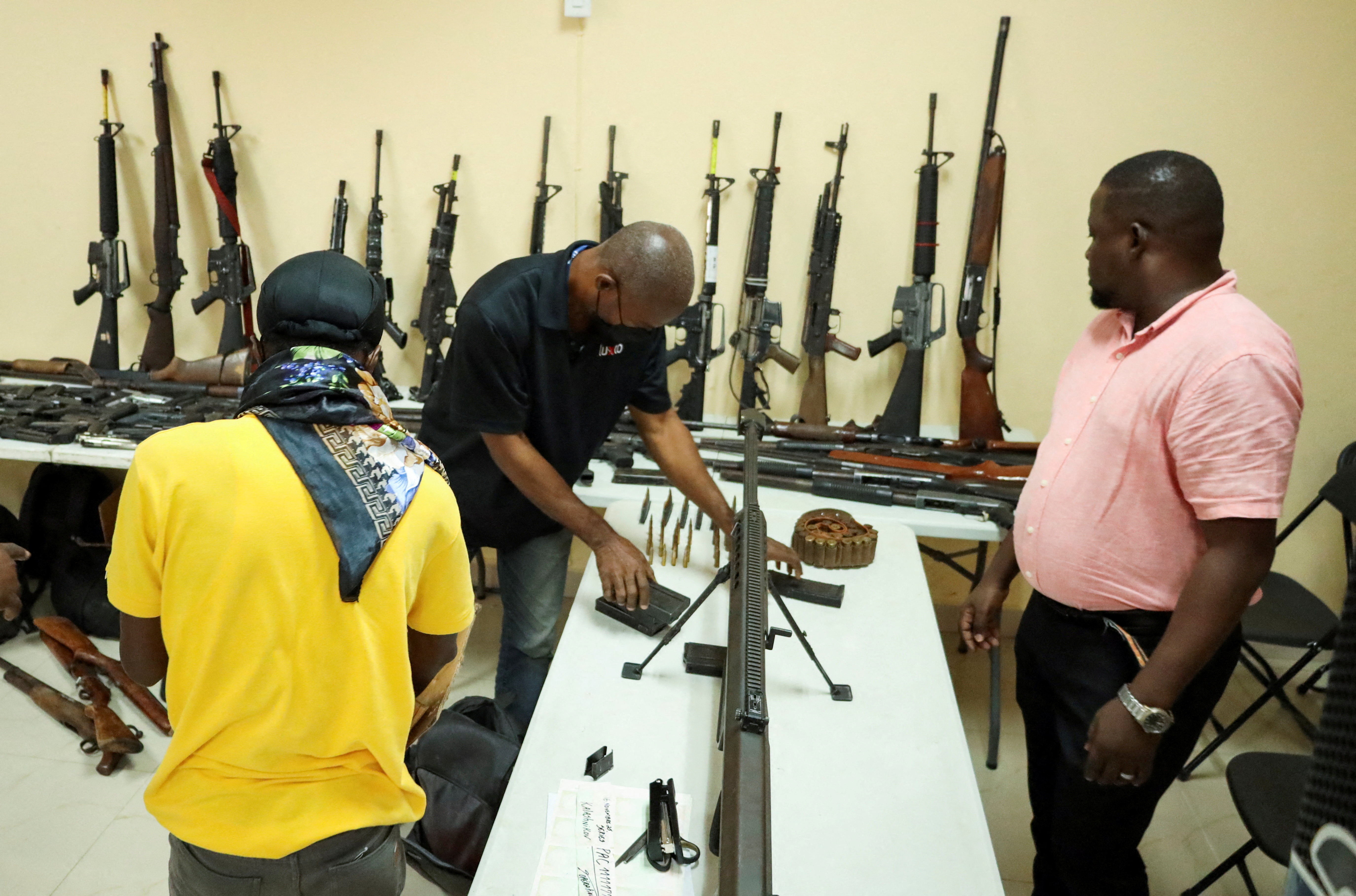 Weapons seized from gangs are seen at a press conference in Haiti