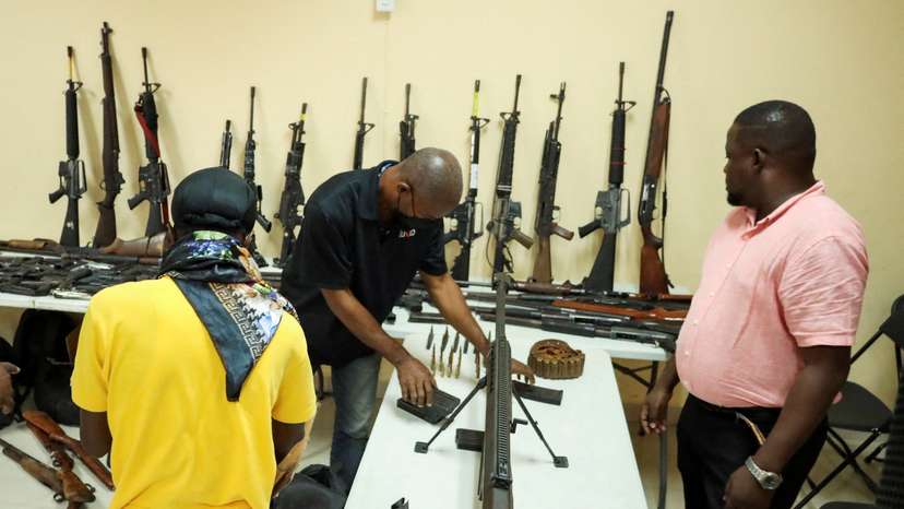 Weapons seized from gangs are seen at a press conference in Haiti