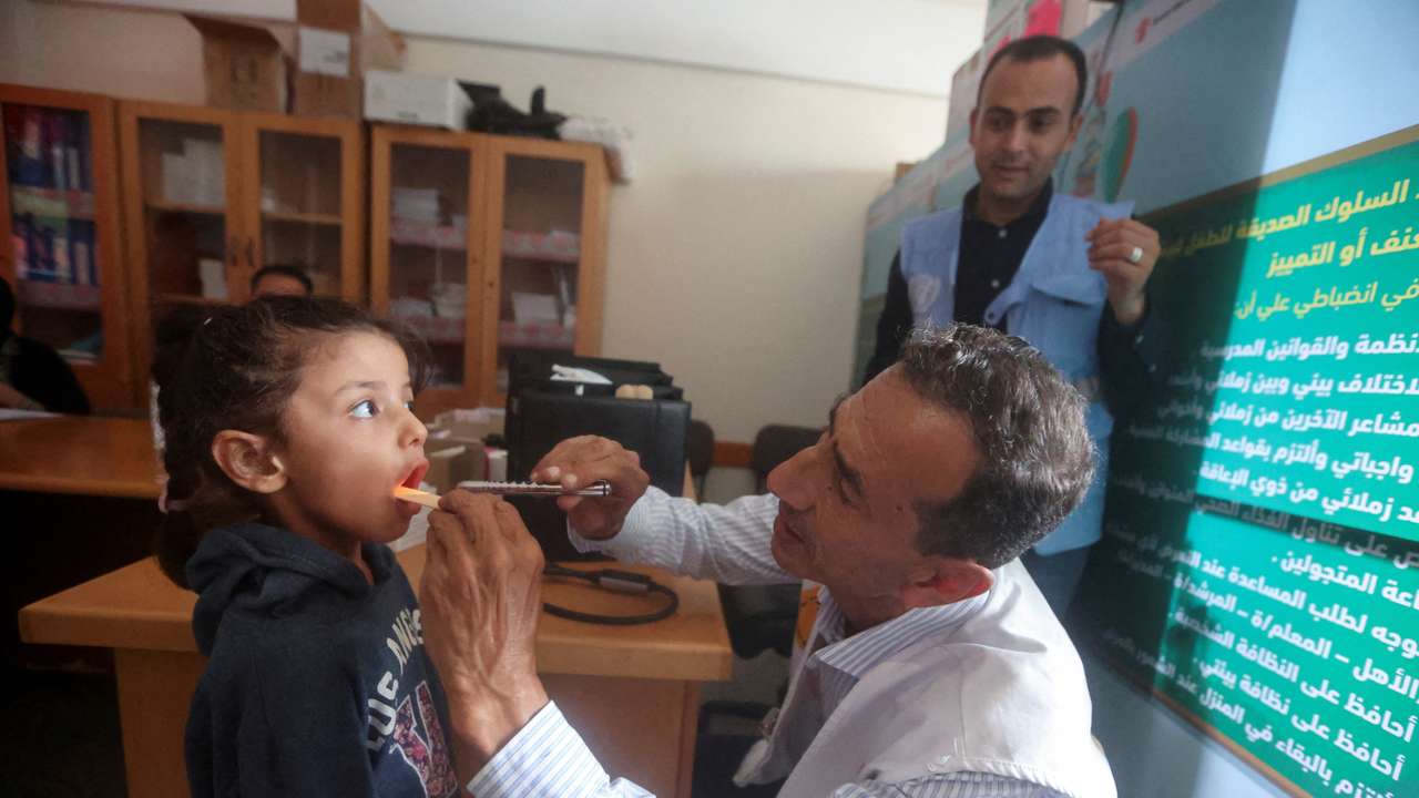 FILE PHOTO: Gaza doctor travels on his bicycle to help displaced patients amid fuel shortages