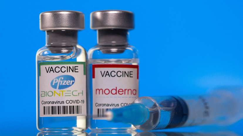 FILE PHOTO: Picture illustration of vials with Pfizer-BioNTech and Moderna coronavirus disease (COVID-19) vaccine labels