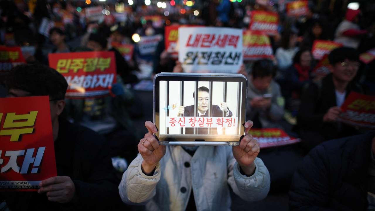 People attend a rally to celebrate expulsion of impeached President Yoon Suk Yeol, in Seoul