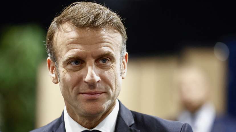 French President Macron votes in the second round of French parliamentary elections