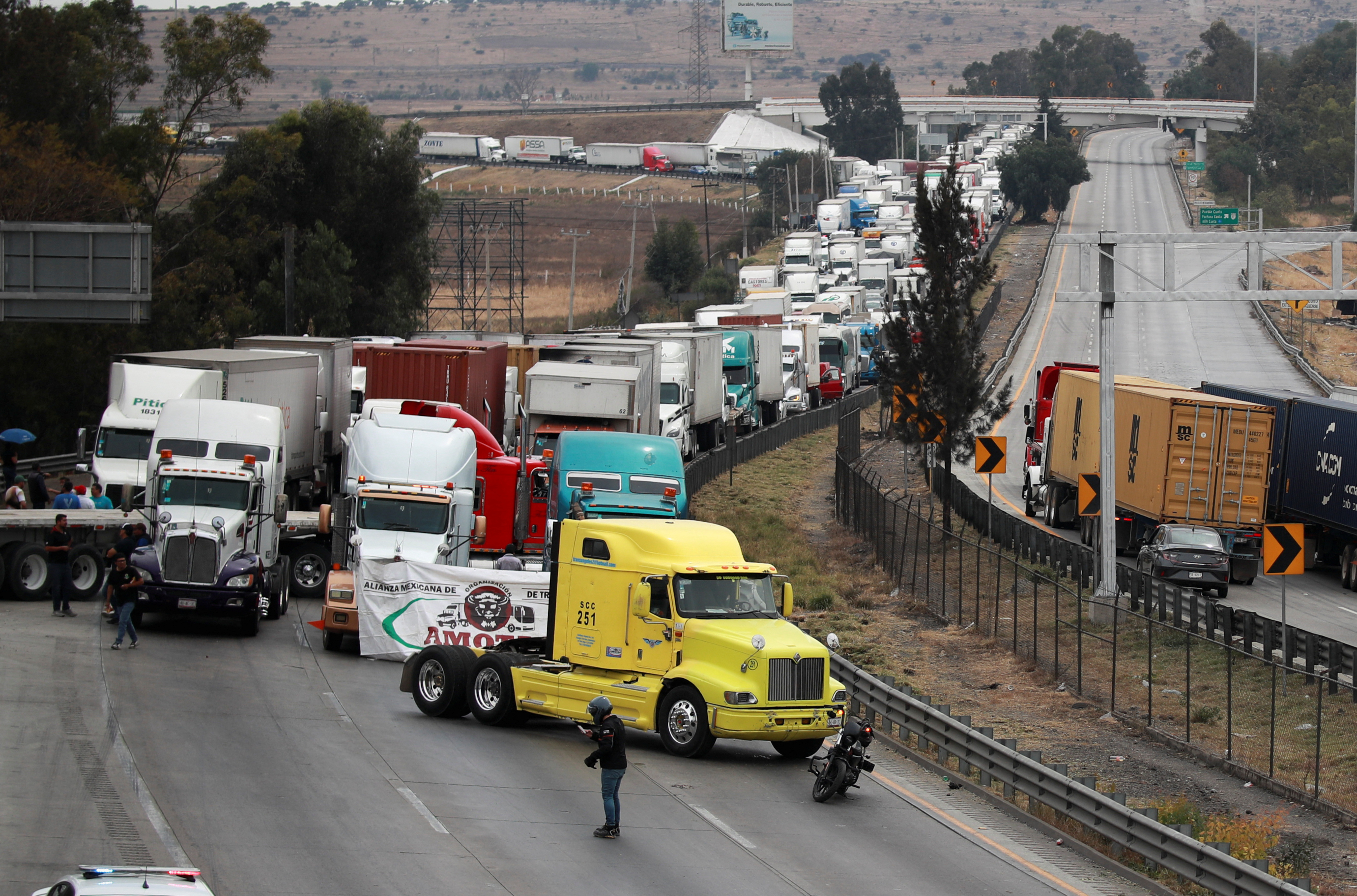 Striking truck drivers block a highway in Jorobas to protest lawlessness on the roads