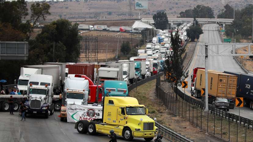 Striking truck drivers block a highway in Jorobas to protest lawlessness on the roads