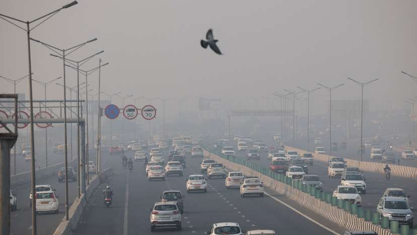 Vehicles ply on a highway, on a smoggy morning amid ongoing air pollution, in New Delhi