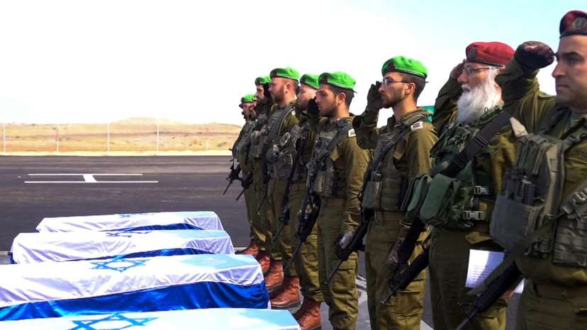 Israeli soldiers recieve the coffines of deceased hostages in Gaza