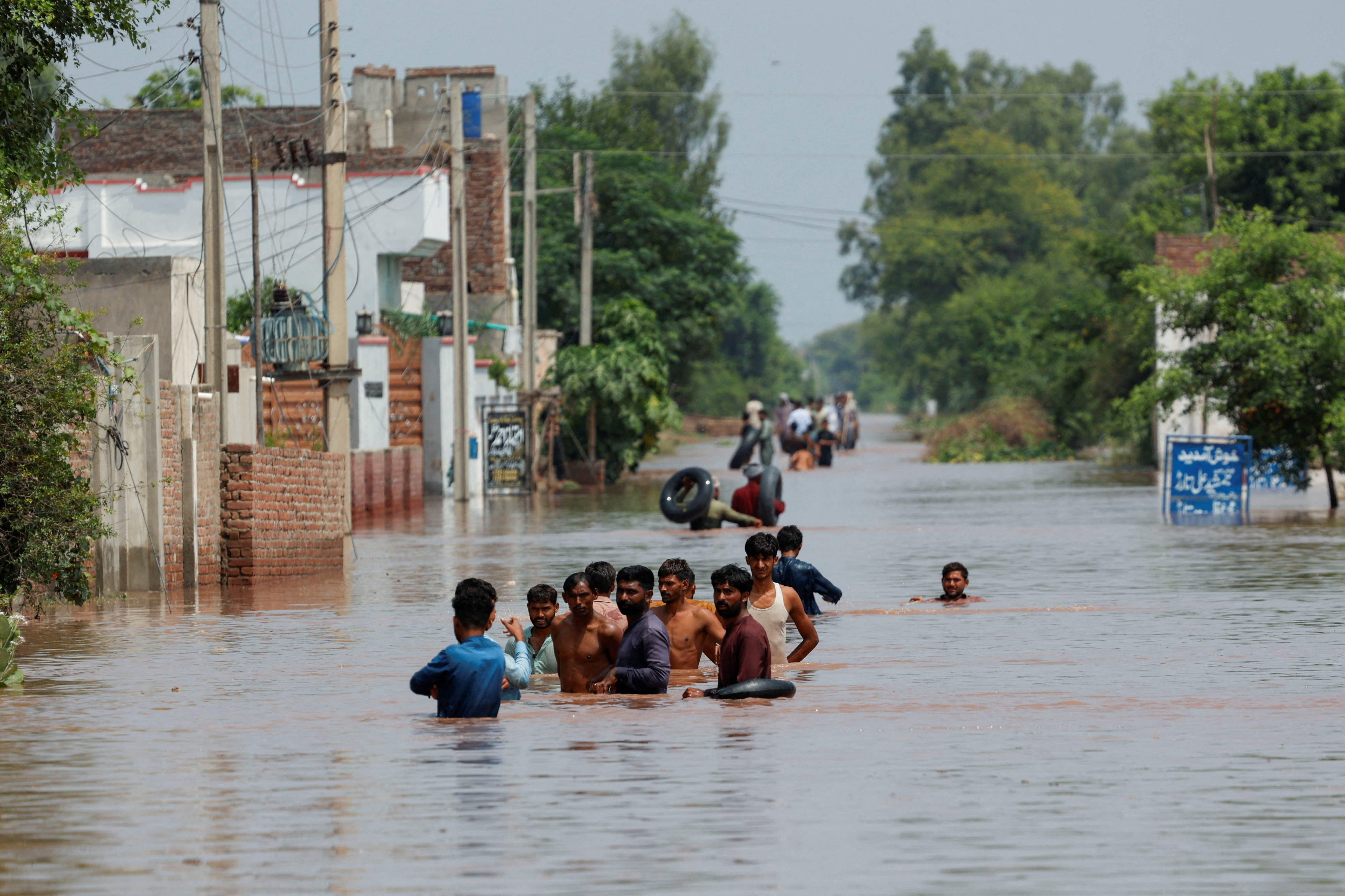 Monsoon rains and rising water levels in Qadirabad village near the Chenab River