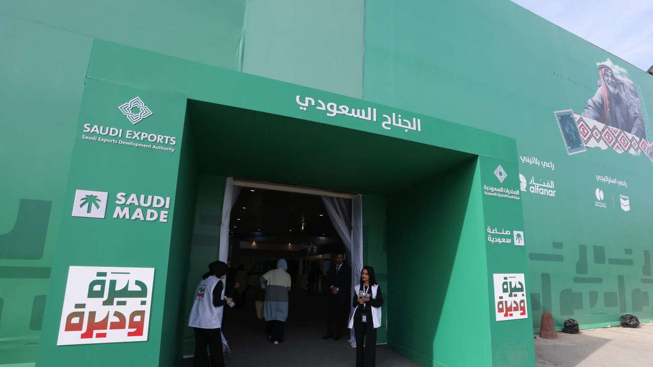 People stand outside a pavilion for Saudi Arabia at Baghdad International Fair, in Baghdad